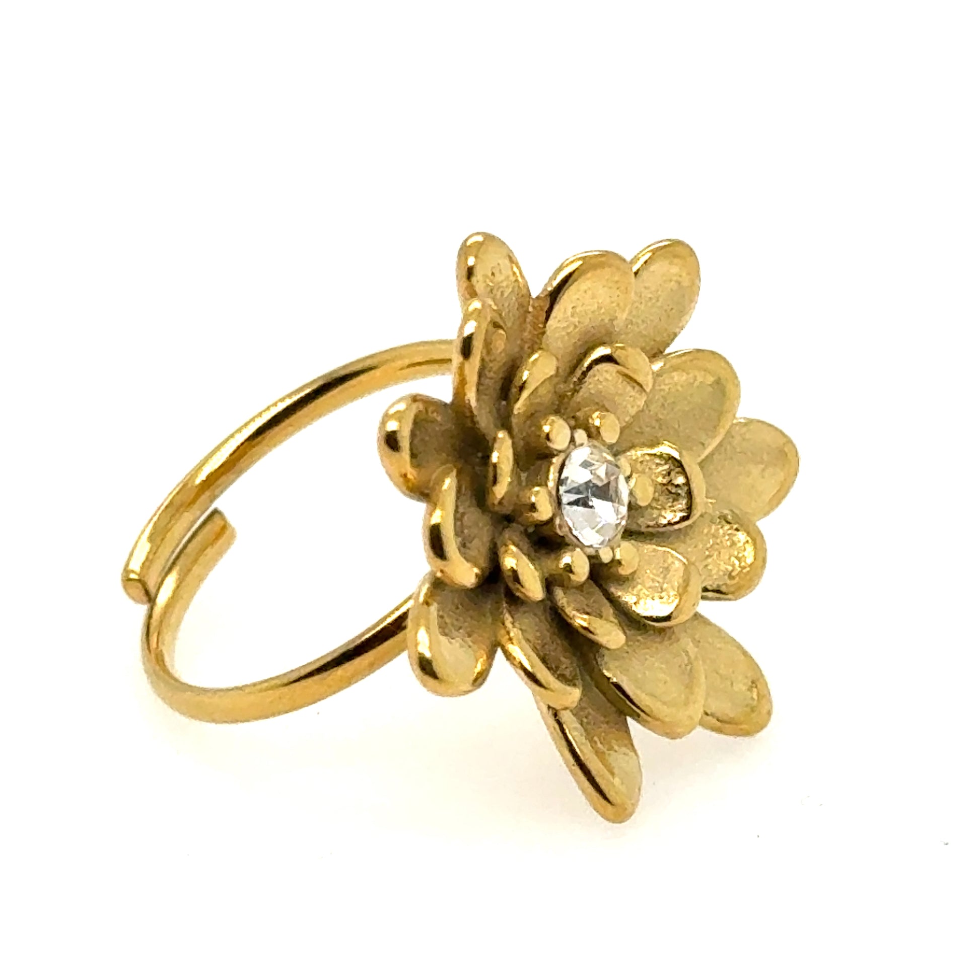 Gold flower-shaped ring with a central crystal on a white background