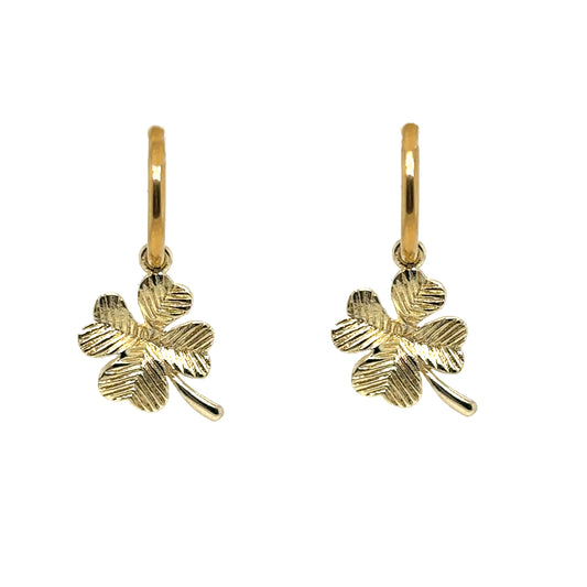 Delicate gold hoop earrings with pretty gold clover charms