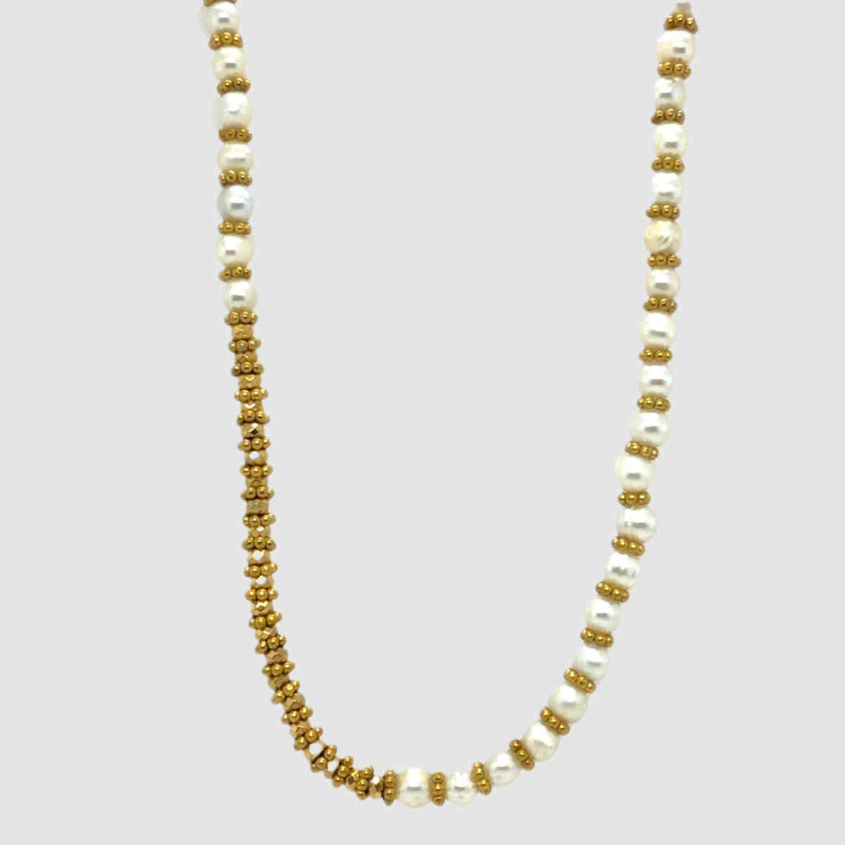 Elegant freshwater pearl necklace with gold rondelle spacer beads.