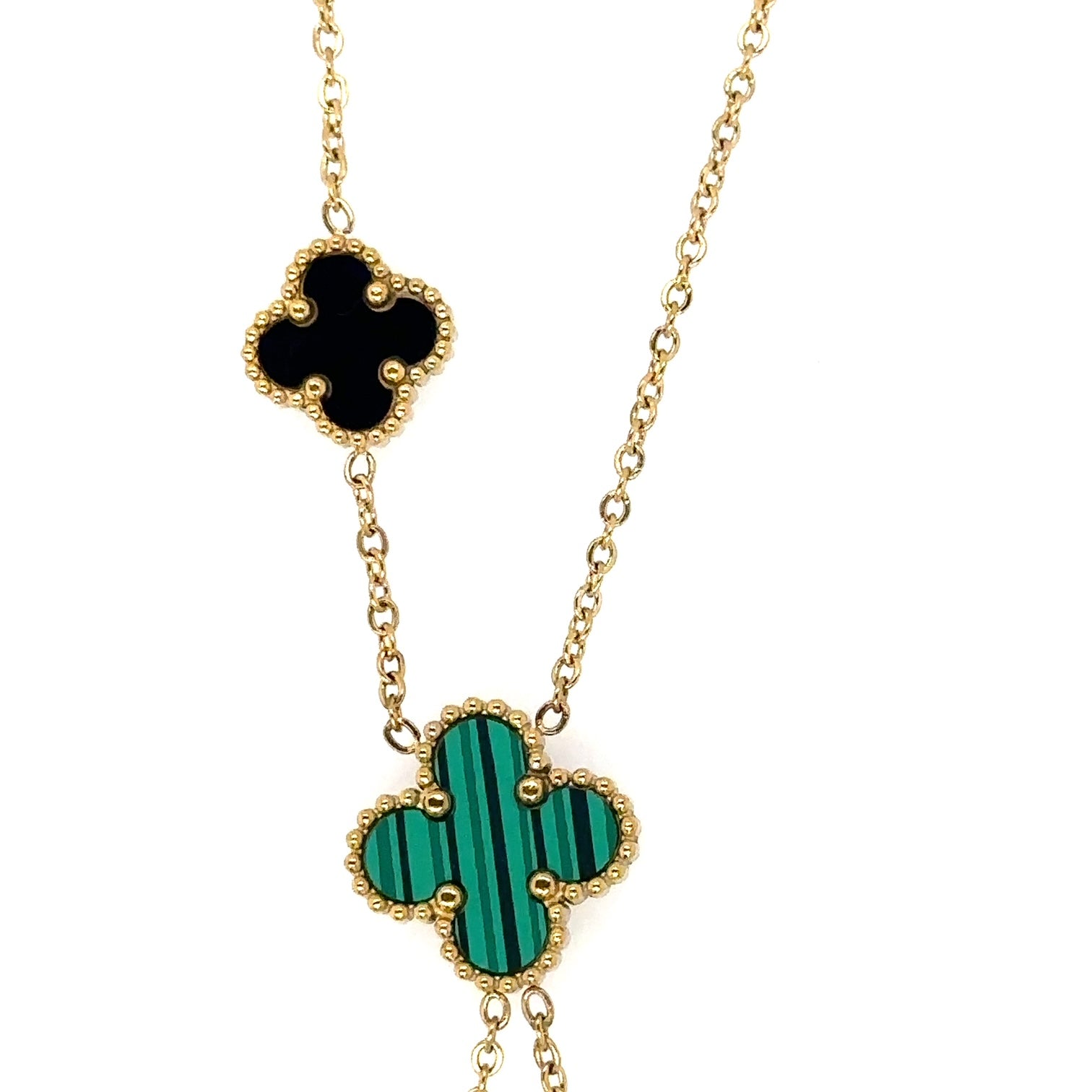 Lariat necklace with five small and medium sized reversible clover charms in black and green