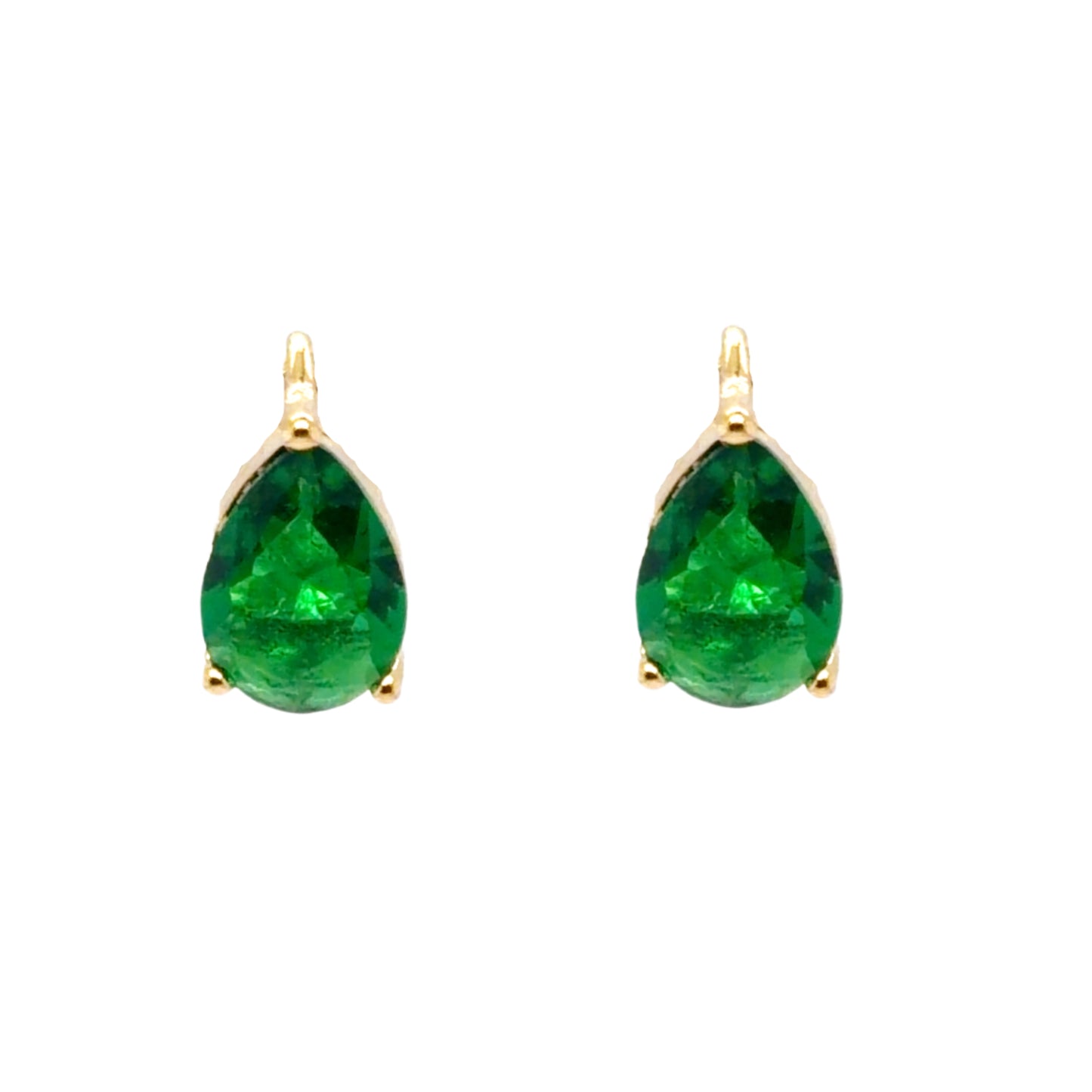 Huggie gold hoop earrings with teardrop shaped emerald green crystal