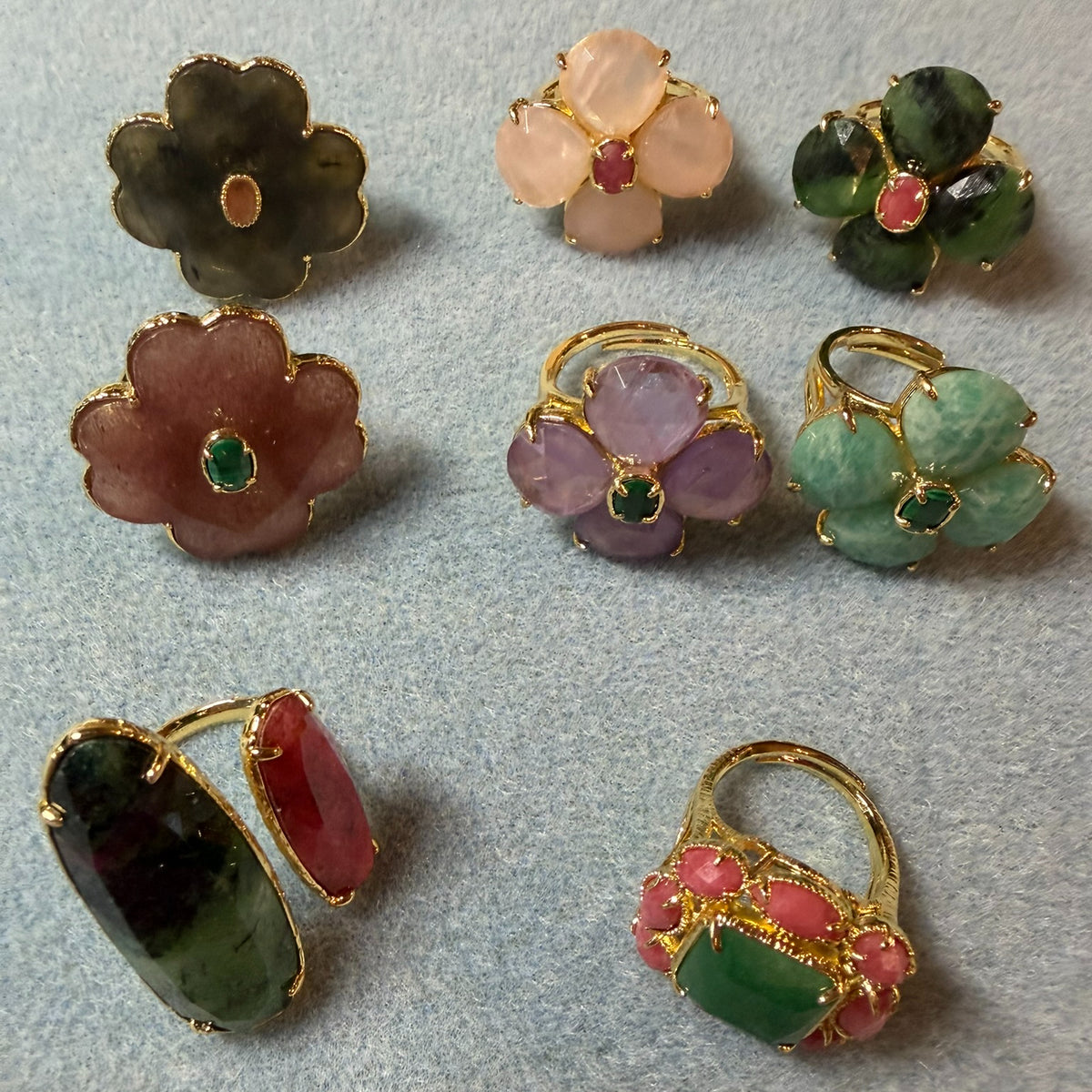 collection of colourful semi-precious gemstone rings