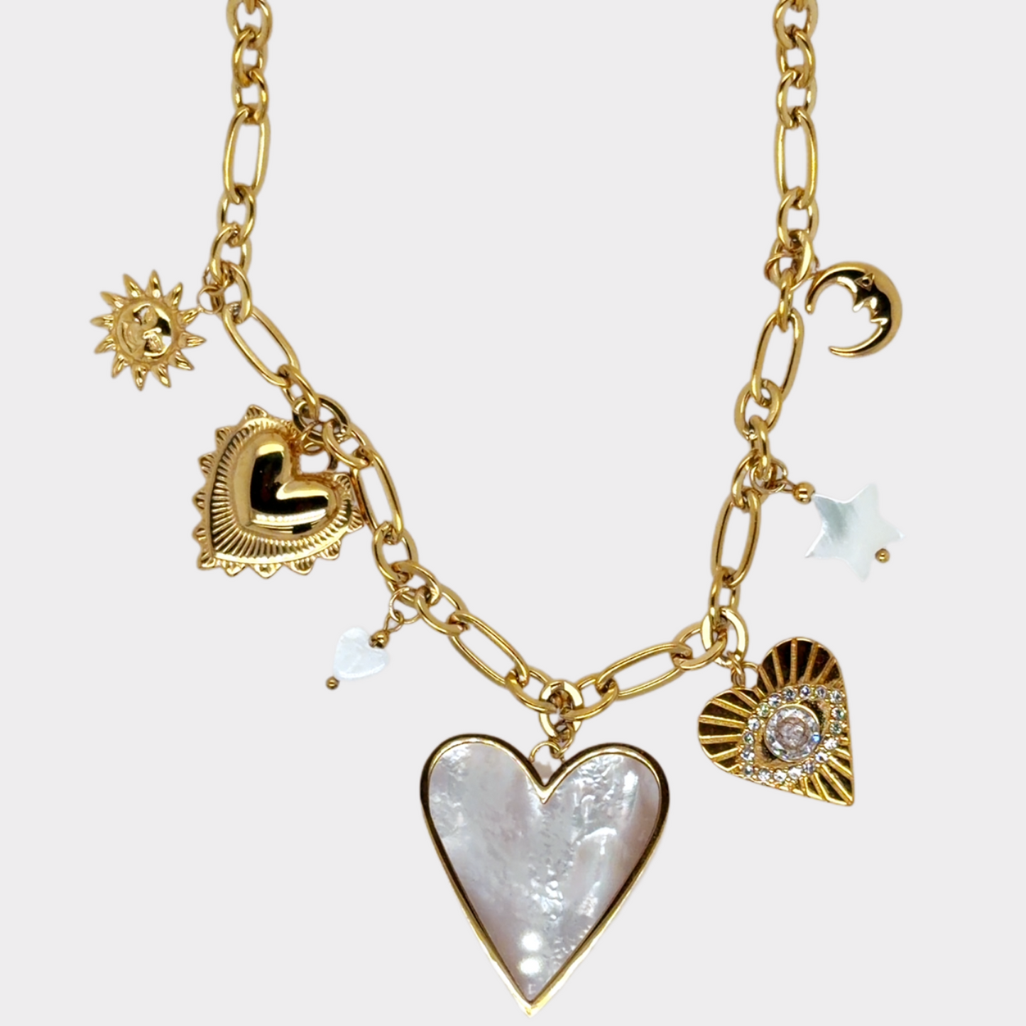 Paperclip necklace with lovely dangling charms including three hearts, a sun and mother of pearl beads.