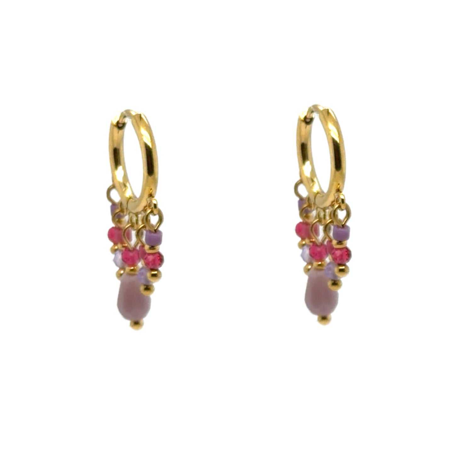 Huggie gold hoop earrings with small pink and purple crystal charms