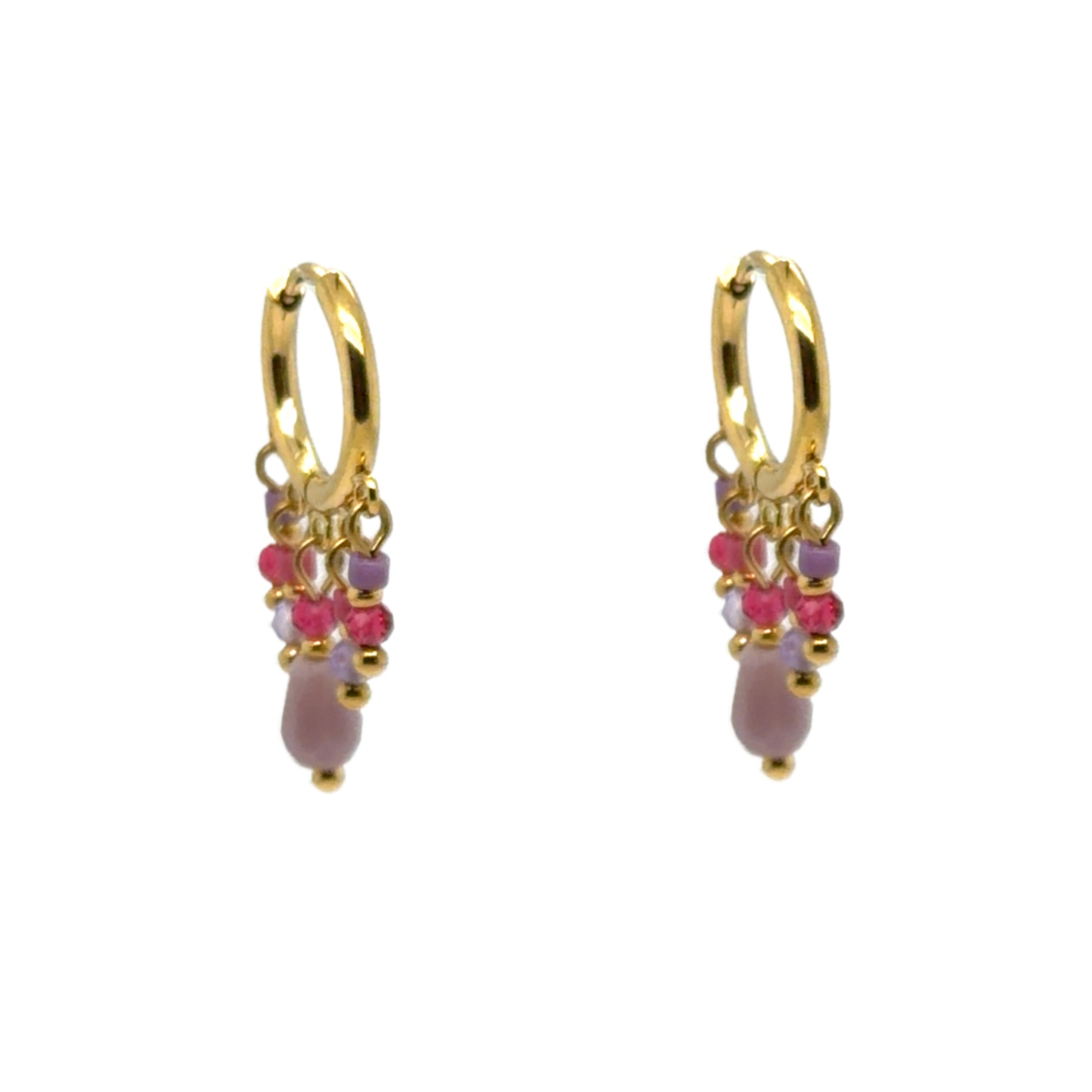 Huggie gold hoop earrings with small pink and purple crystal charms