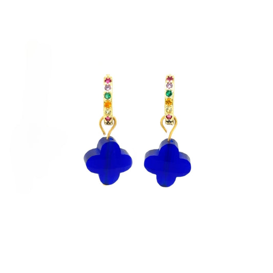Huggie gold hoop earrings with rainbow zirconia stones and clover shaped charms in cobalt blue