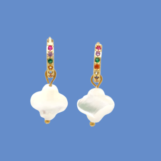 Huggie gold hoop earrings with rainbow zirconia stones and clover shaped charm in white mother of pearl shell