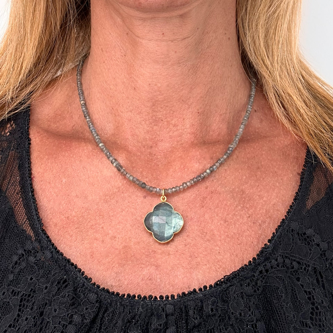 Necklace with beautiful iridescent Labradorite gemstones all around and with one 18mm Labradorite clover charm dangling at the front worn on model