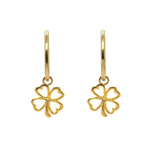 Delicate medium sized gold hoops with clover outline gold charms