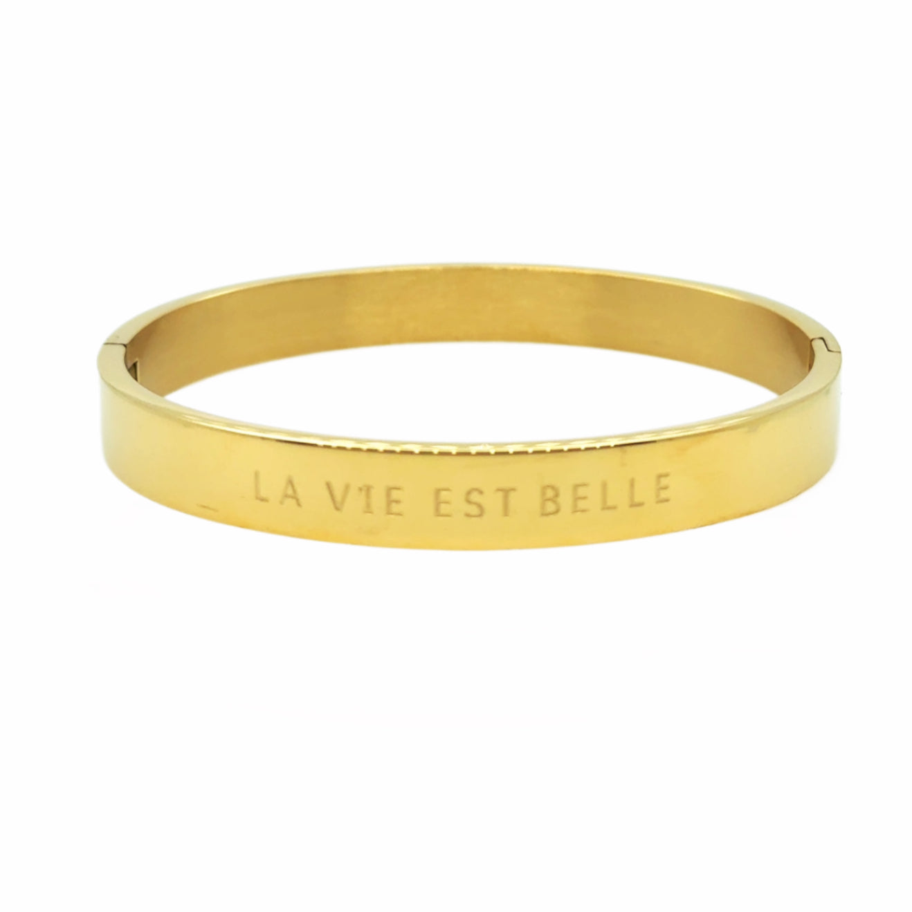 gold bangle which is engraved with the phrase: La Vie Est Belle - life is beautiful!