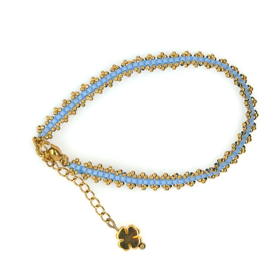 Lovely bracelet with light blue Miyuki beads woven with gold beads