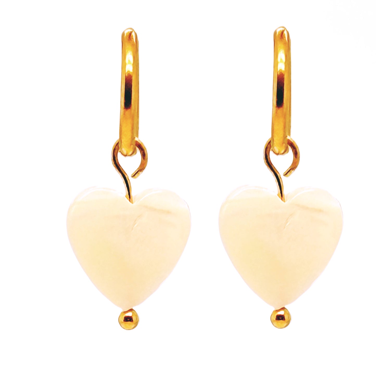 Delicate gold hoop earrings with mother of pearl heart shaped charms