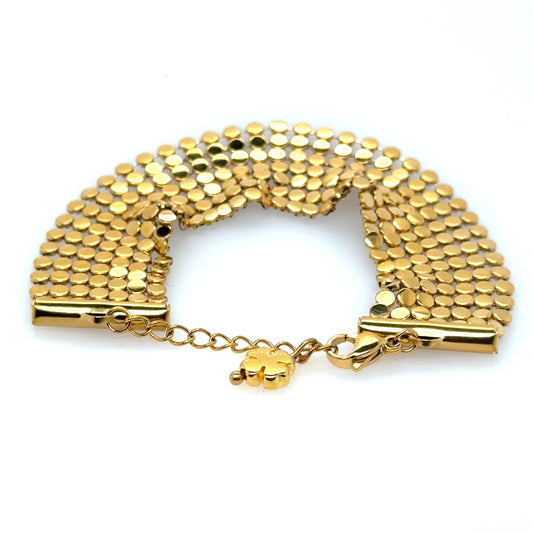 This bracelet has 7 rows of gold discs meshed together to create a lovely shimmering look