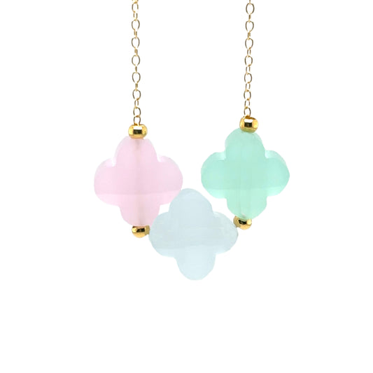 Delicate gold chain with three clover glass charms in pastel pink, blue and green