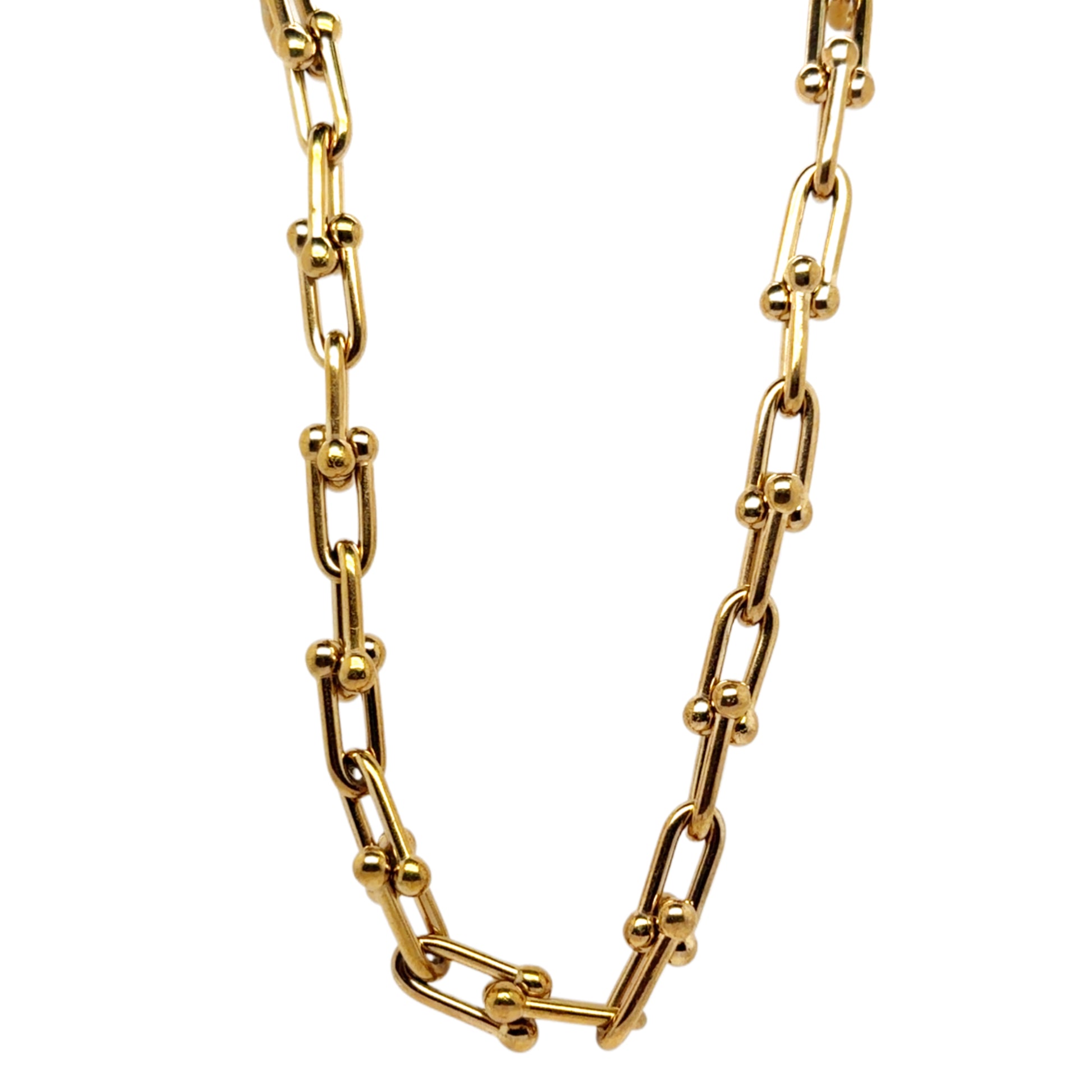 Gold chain necklace on a white background