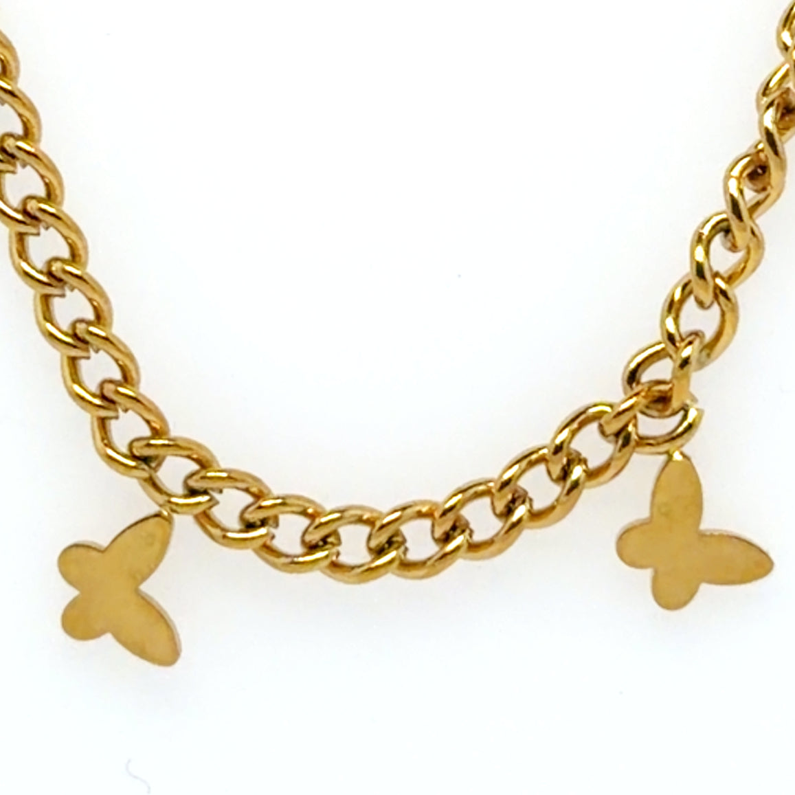 Gold chain necklace with butterfly charms on a white background