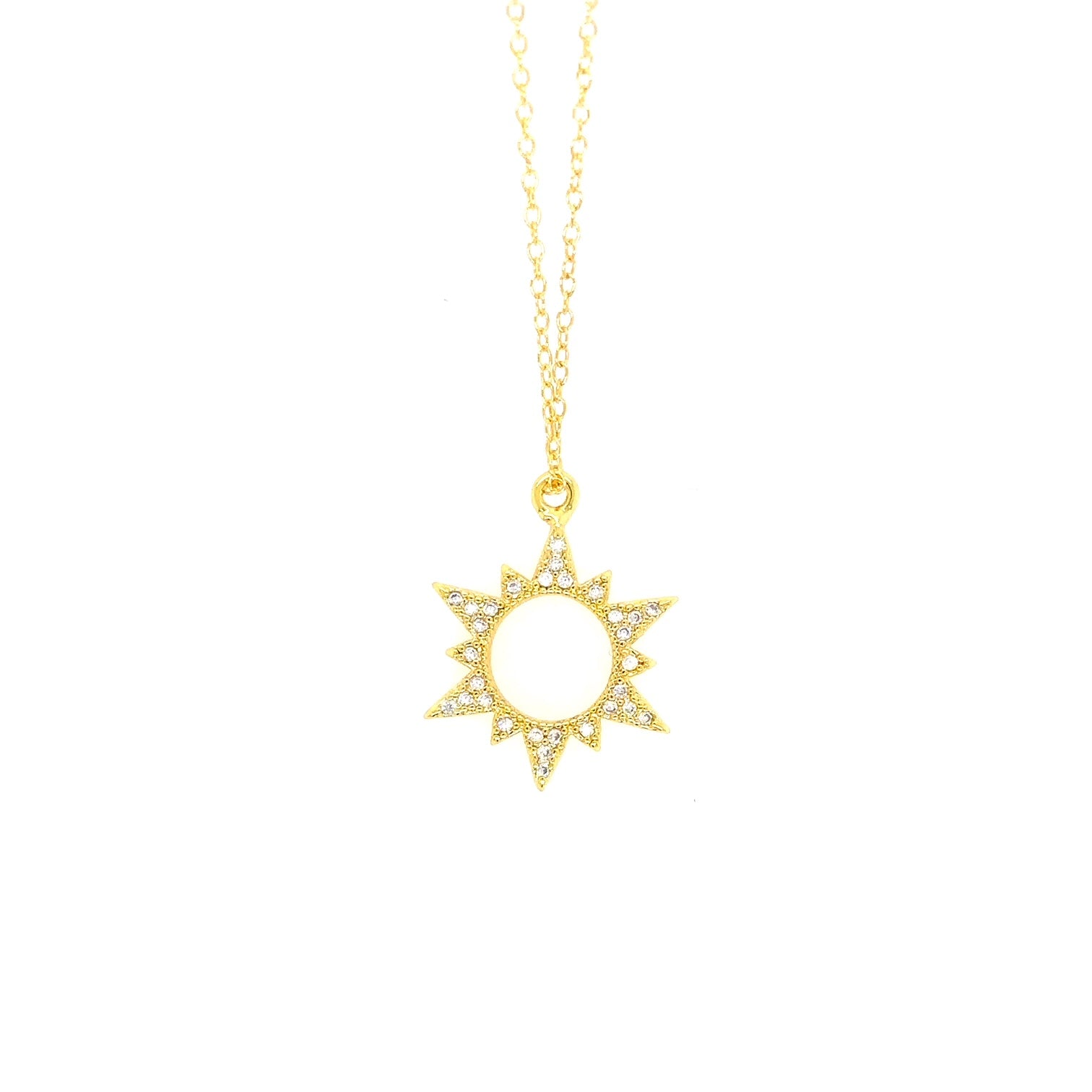 Delicate gold chain necklace with sparkly sun shaped charm