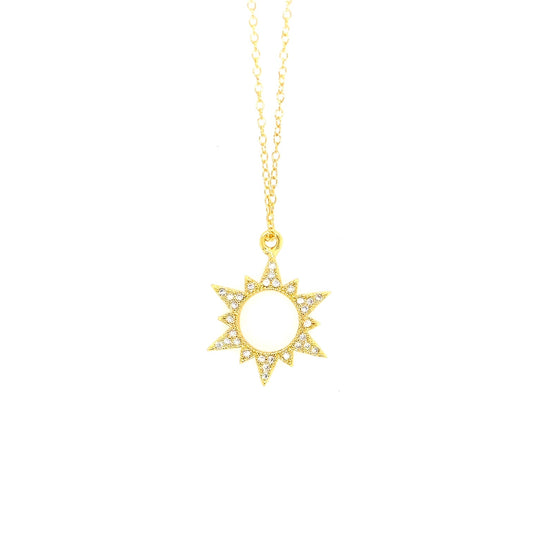 Delicate gold chain necklace with sparkly sun shaped charm