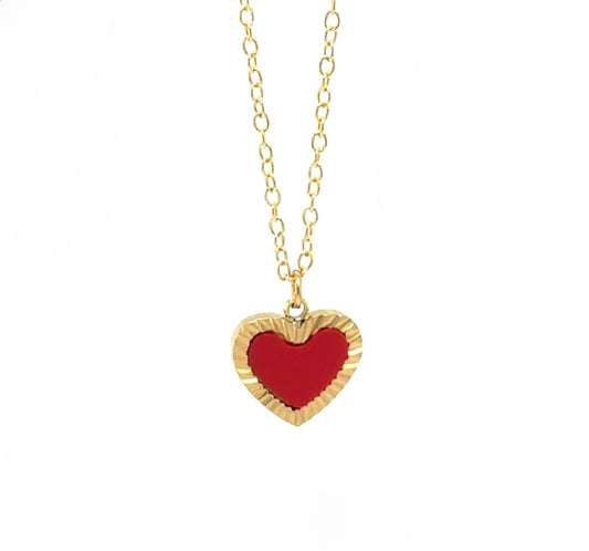 Delicate gold chain necklace with one heart shaped charm in red and gold