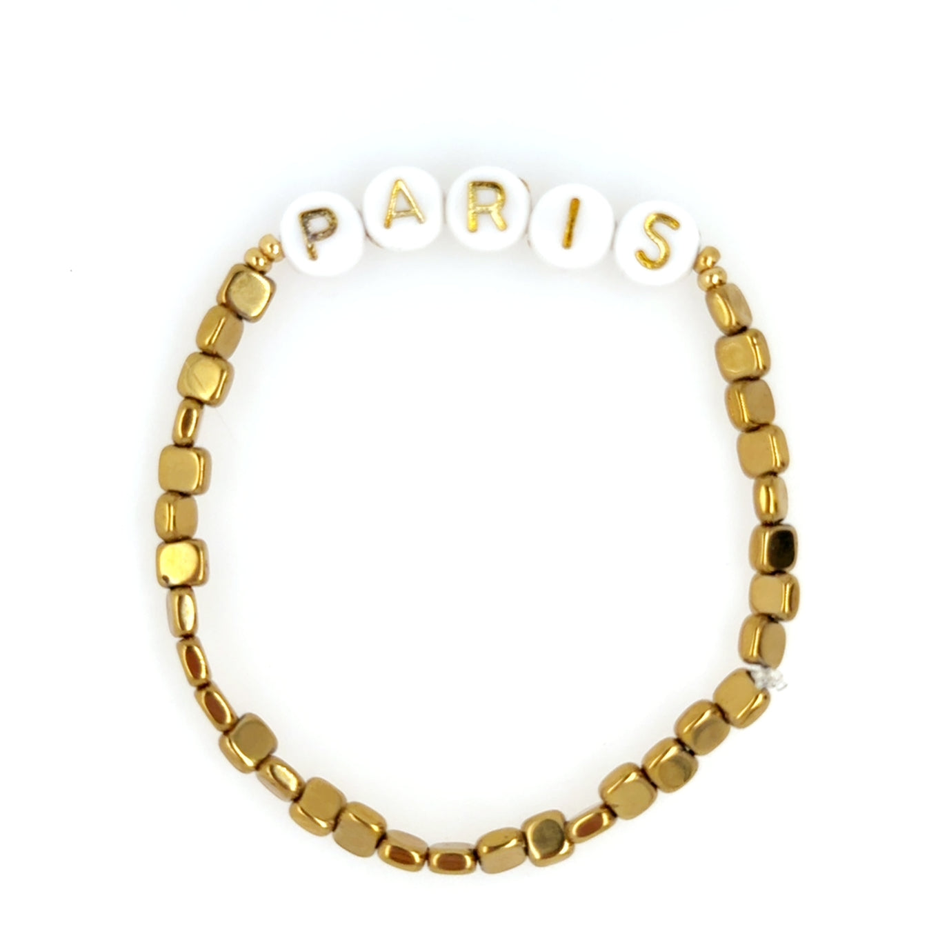 Stretchy bracelet with PARIS written in gold letters on white beads and small square Hematite gemstone beads all around