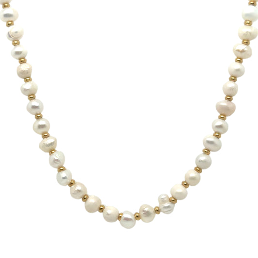Elegant freshwater pearl necklace with small gold bead dividers