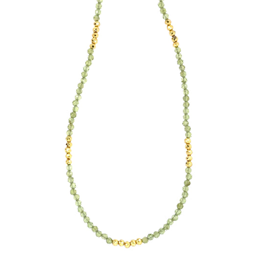 Necklace with bright green Peridot and golden pyrite beads all around.