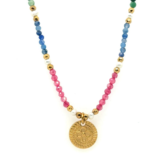 Lovely necklace with tiny blue, pink, green and pearl beads and small gold charm in the middle