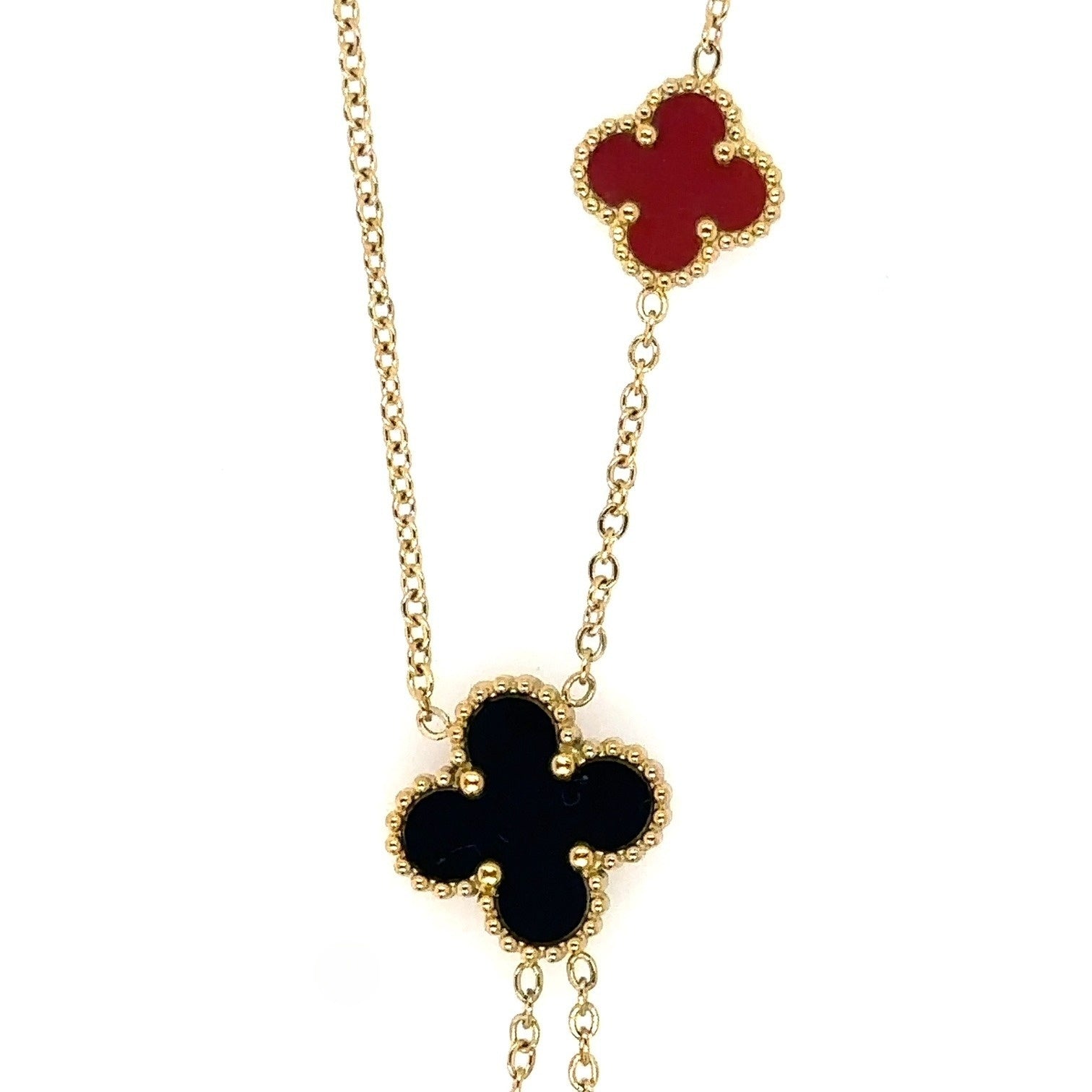 Lariat necklace with five small and medium sized reversible clover charms in black and red