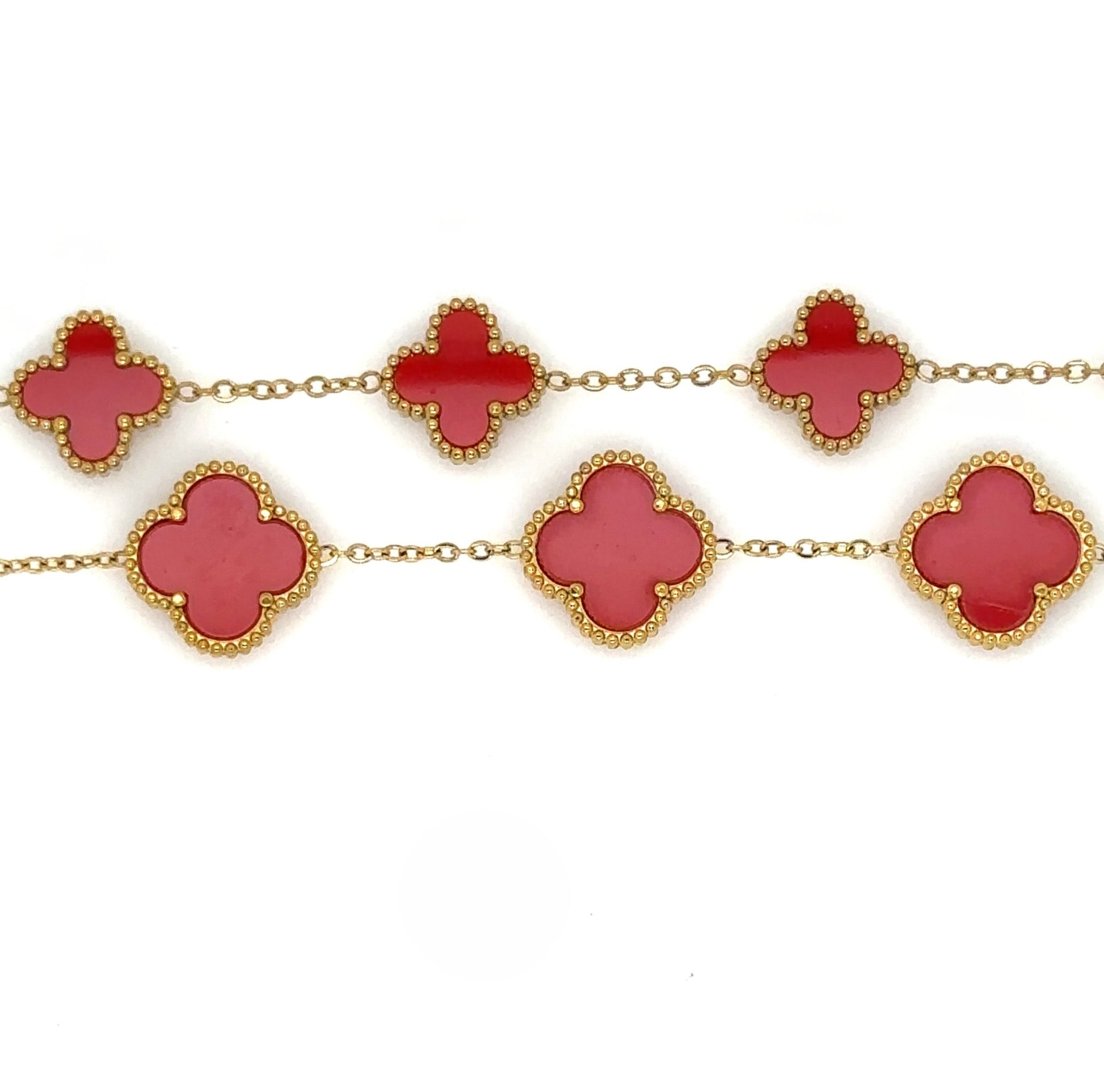 Two bracelets with five small and large clover charms in red enamel