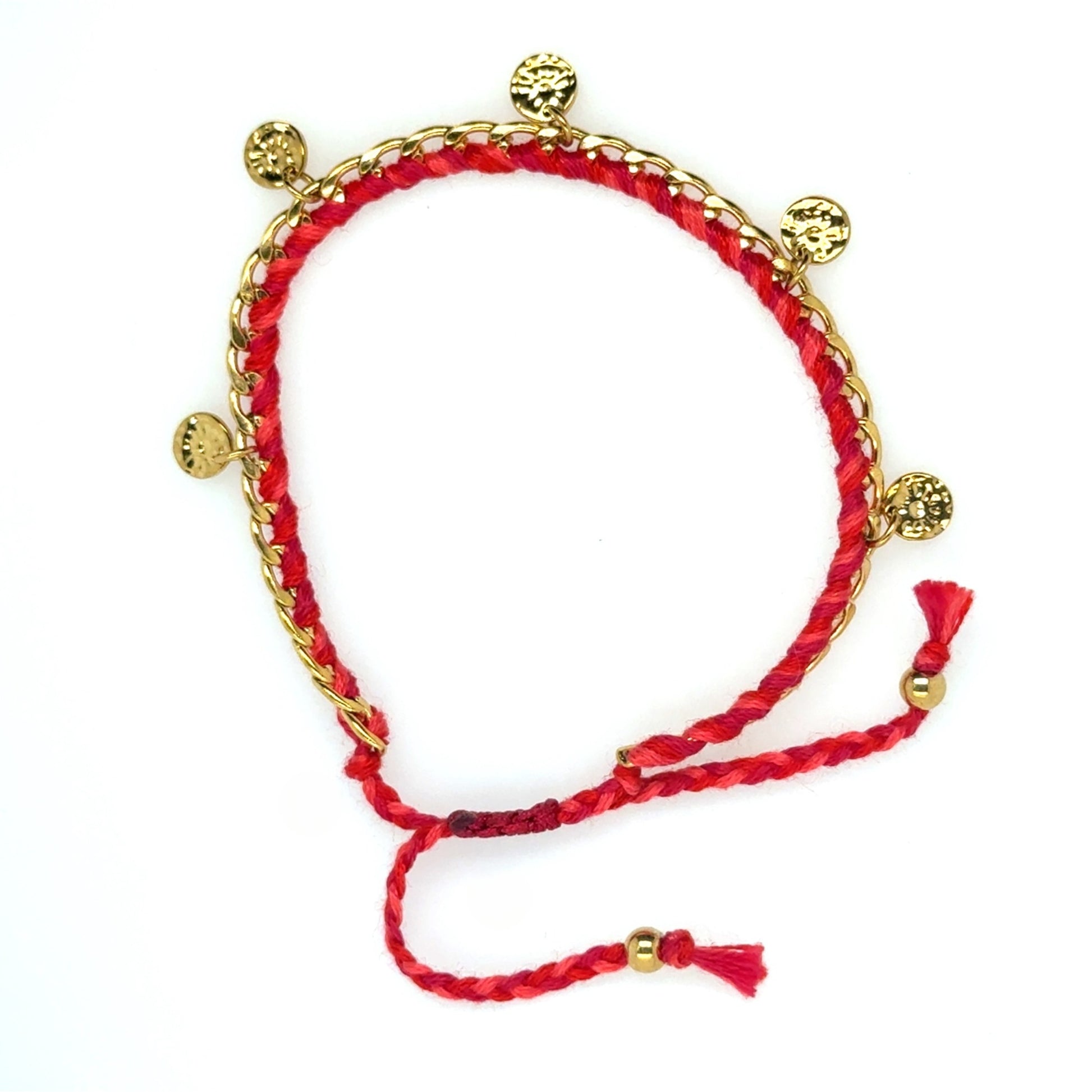 Bracelet has a gold chain interwoven with red string and gold discs dangling all around
