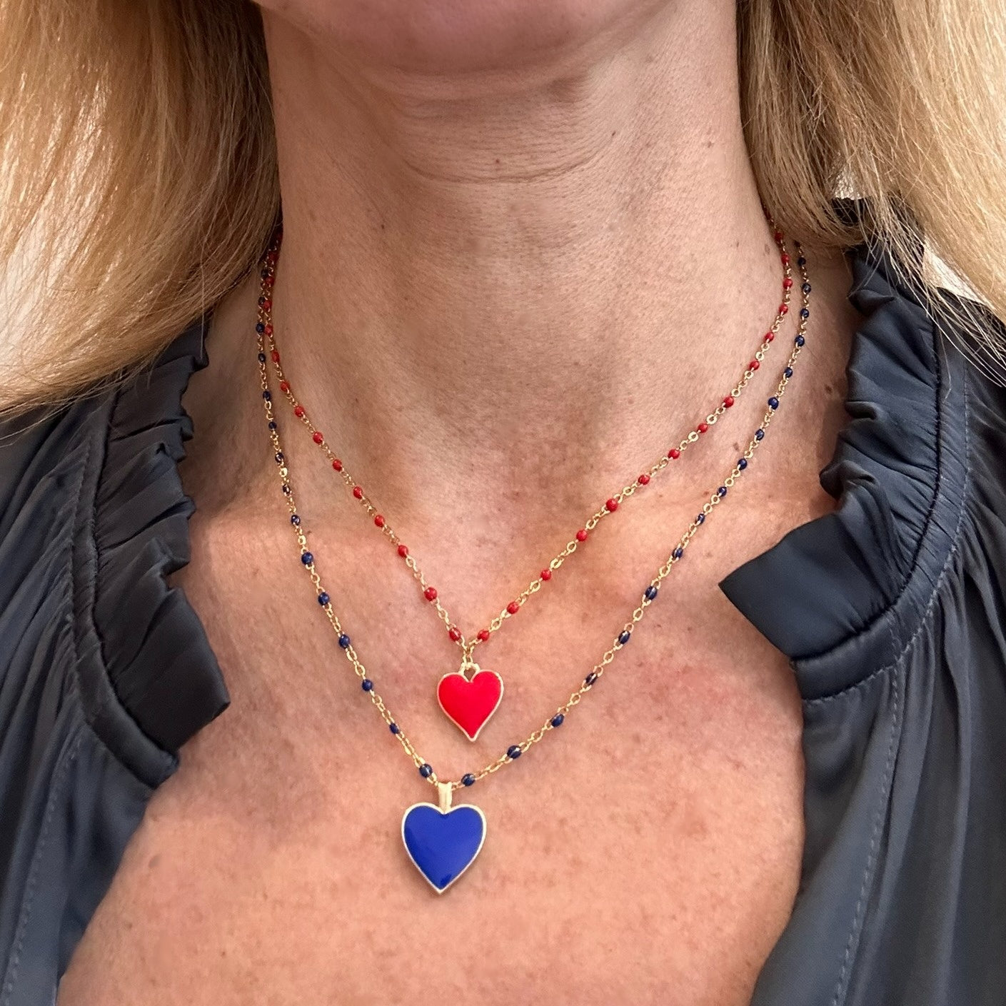 rosary gold chain necklaces with one enamel heart charm in  red and in blue together