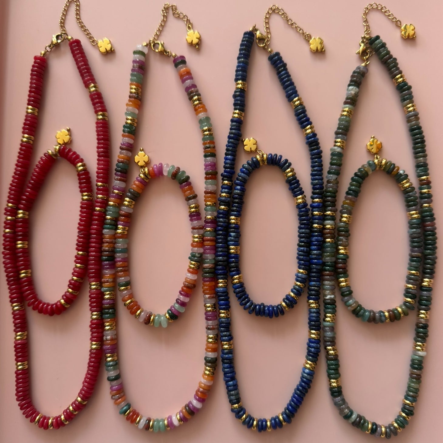 Four styles of necklaces and beads with different coloured rondelle beads including Lapis Lazuli, Unakite, Red Jasper and a rainbow of gemstones