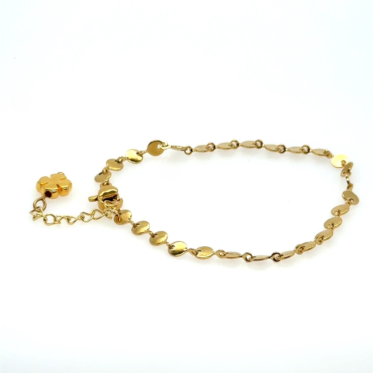 Gold bracelet on a white background