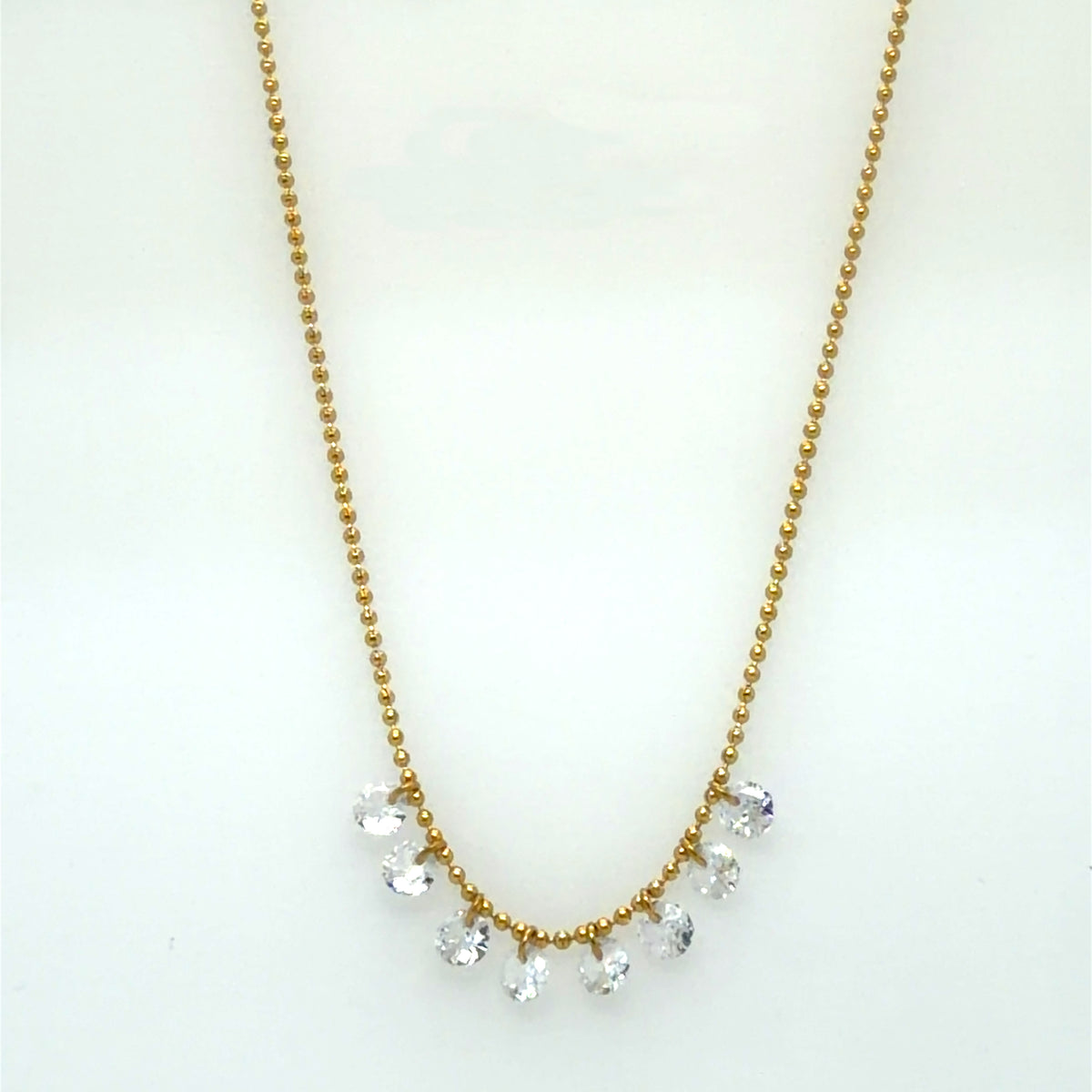 Ball chain necklace with 8 sparkly rounded rhinestone crystals in the centre