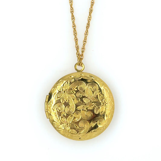 Delicate twisted belcher chain necklace with round locket with a lovely floral engracing that opens at the side and can hold two little photos