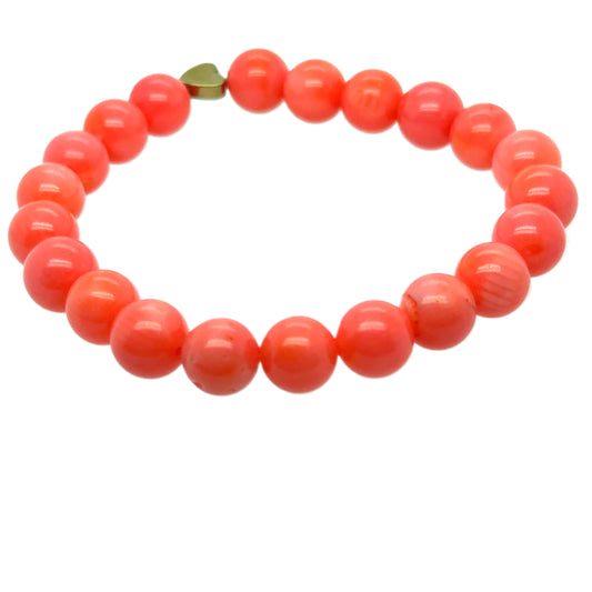 This bracelet is made with 8mm pink Sea Bamboo and a small Hematite heart bead on a strong stretchy elastic