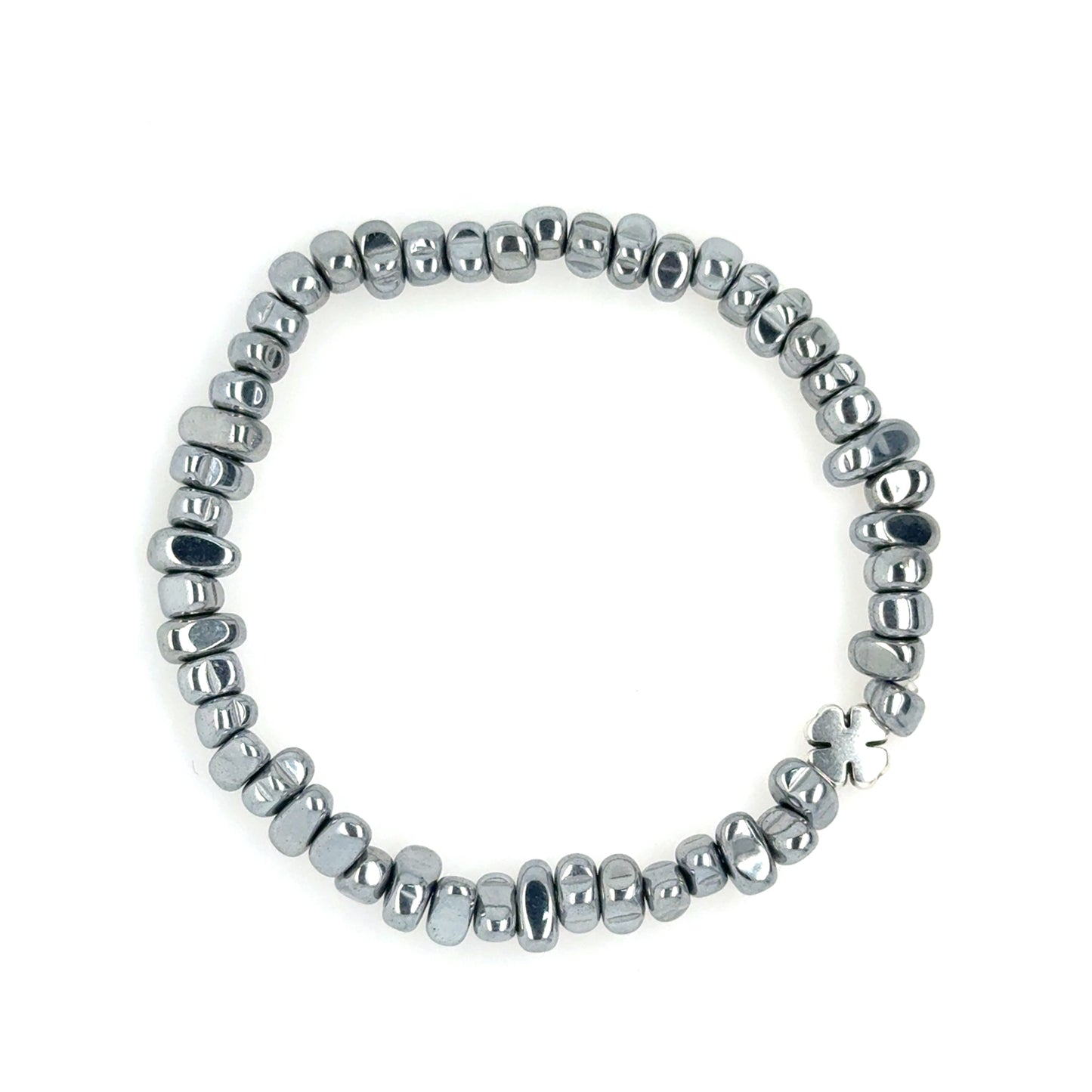 Lovely stretchy bracelet with silver Hematite semi-precious gemstone beads shaped like pebbles and a small silver clover charm for good luck!