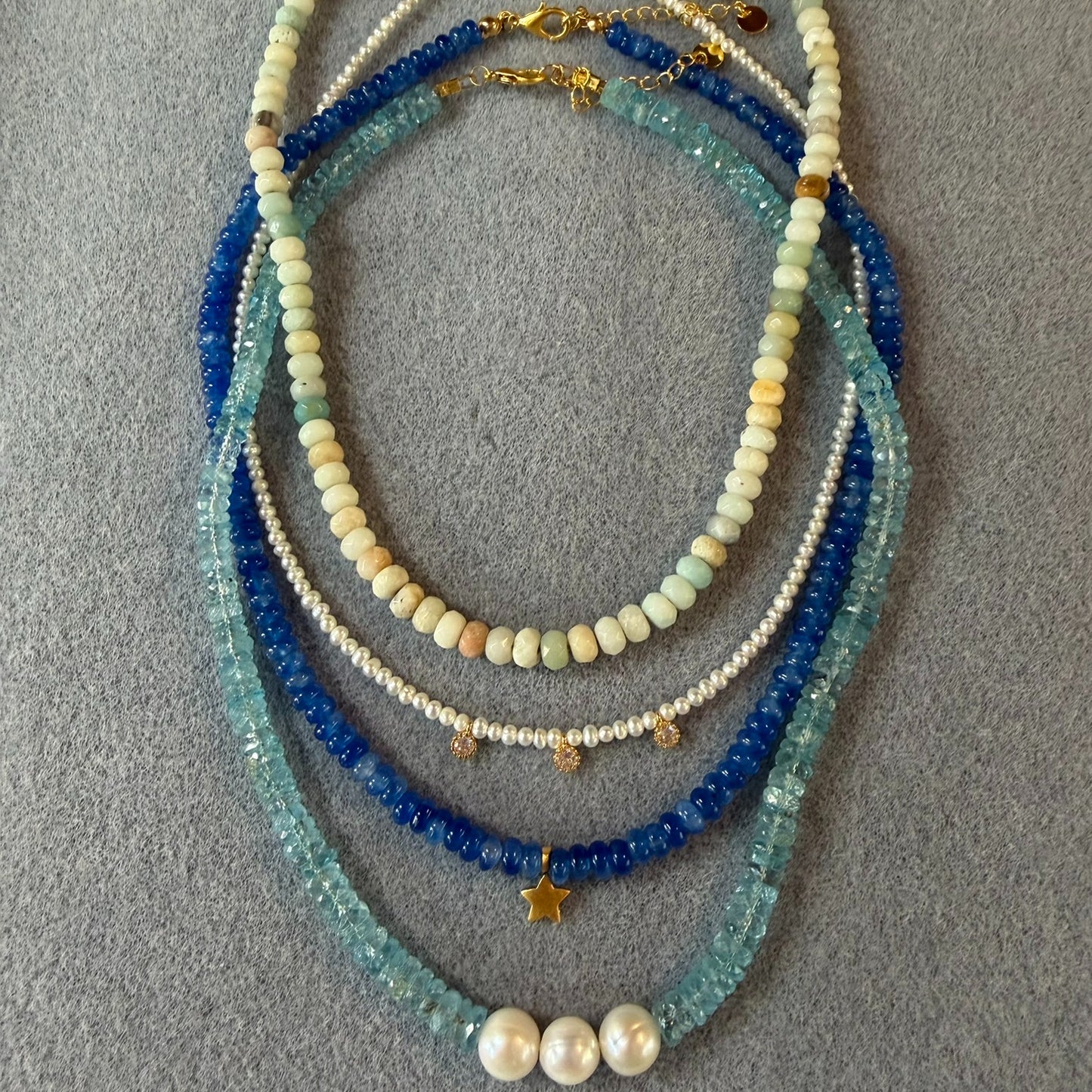group  of rondelle bead necklaces in blue stones and pearls