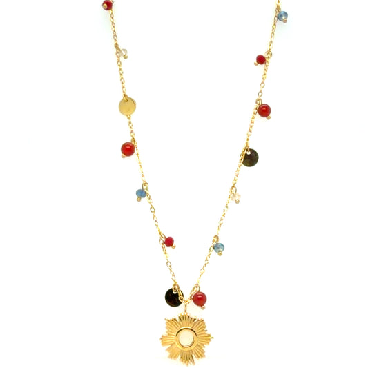 Gold necklace with delicate chain, dangling red and light blue beads, gold discs, and lovely gold sun charm in the centre.