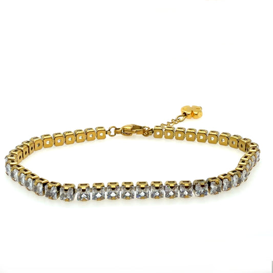 A gold tennis bracelet featuring a row of clear square-cut rhinestones on a white background.