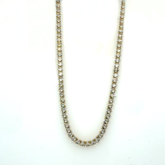 A tennis-style necklace with clear rhinestones set in a silver-tone metal, shown against a plain white background.