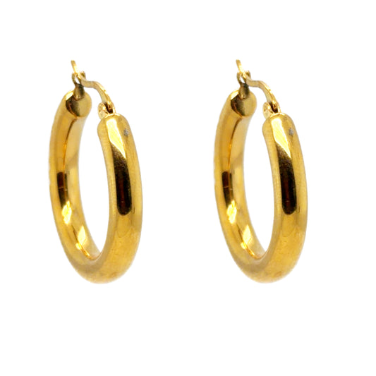 Chunky gold hoops with 30mm diameter.