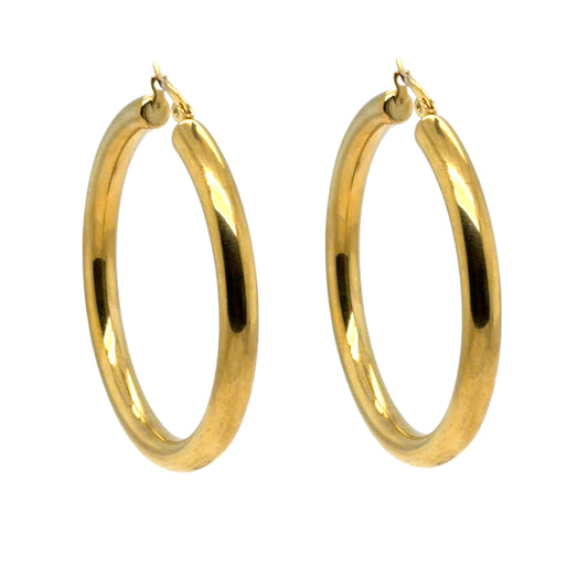 Gold hoop earrings on a white background