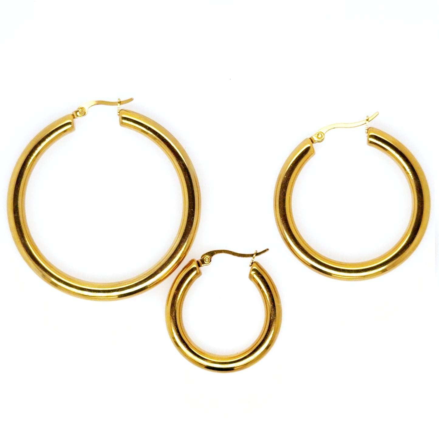 three sizes of gold hoop earrings