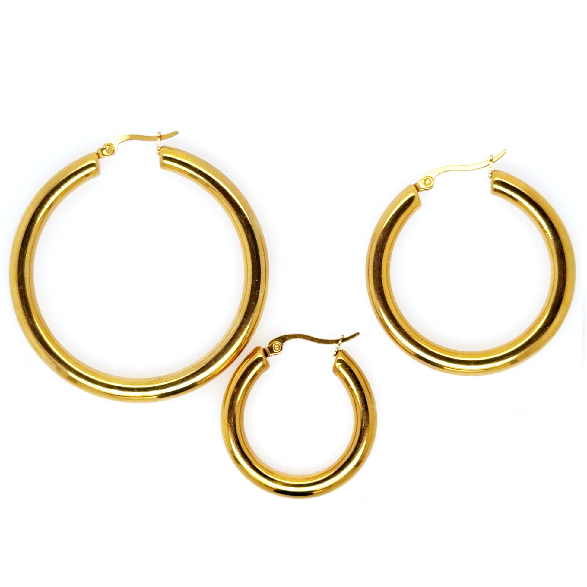three sizes of gold hoop earrings