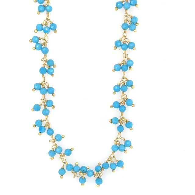 necklace with bright turquoise gemstone beads arranged in clusters