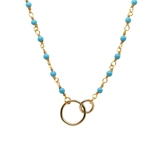 Gold rosary chain with turquoise enamel and interconnected circles in the middle