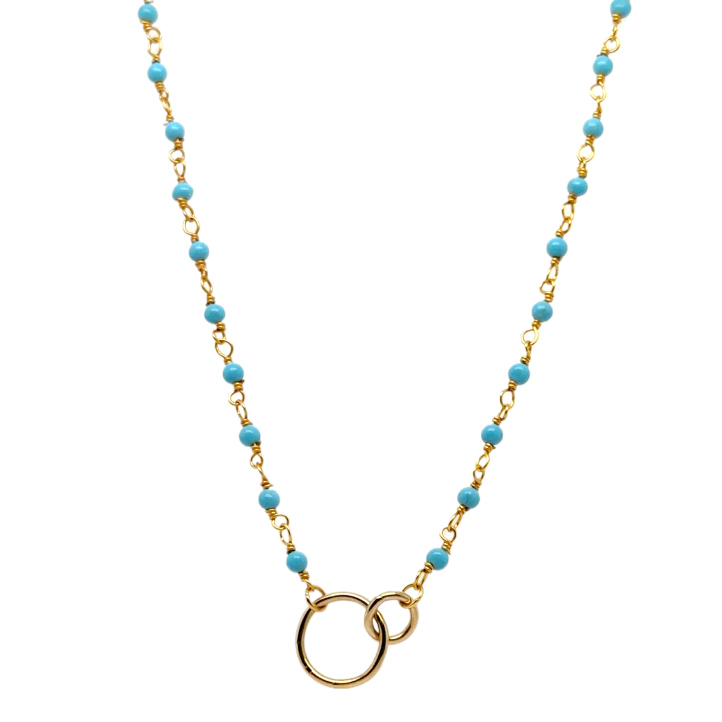 Gold necklace with turquoise beads on a white background