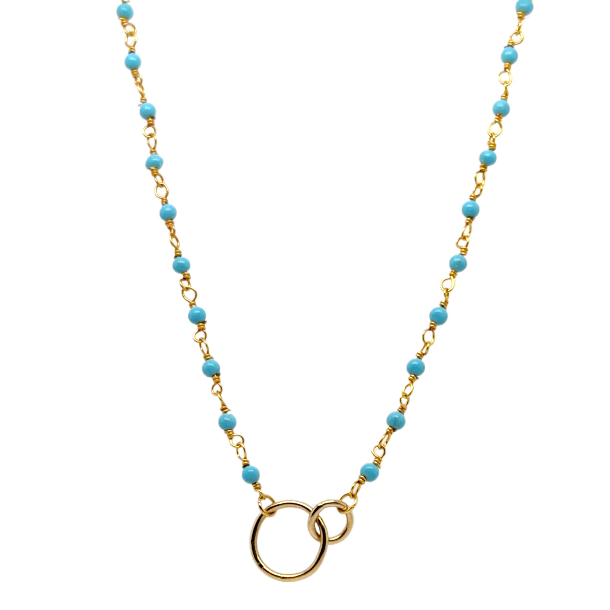 Gold necklace with turquoise beads on a white background