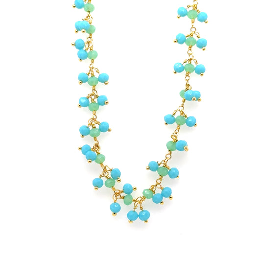 Gold necklace with bright blue Aquamarine and green Prehnite gemstone beads arranged in clusters